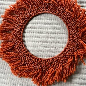 10 inch round macrame wall hanging on metal hanger